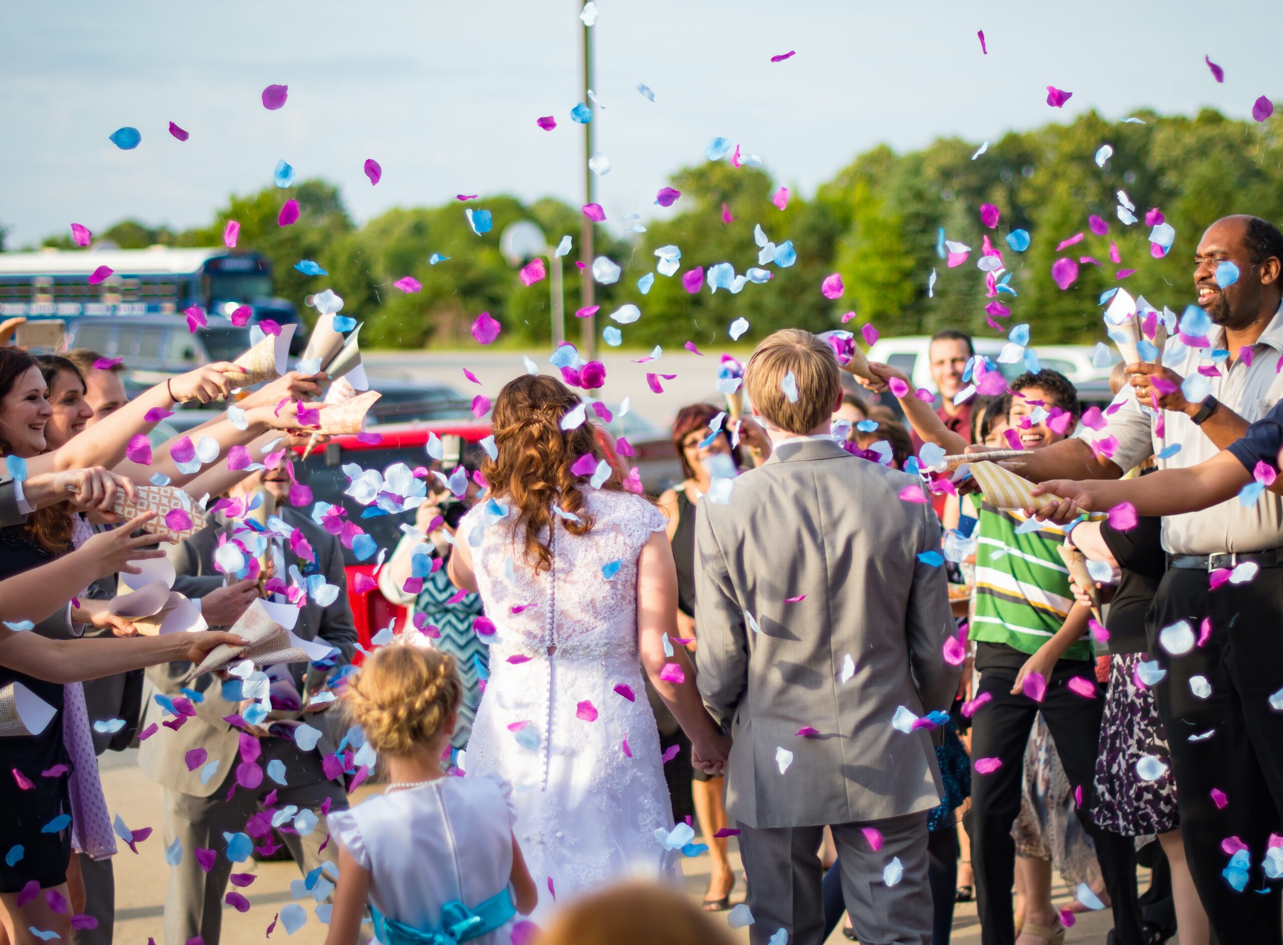 bride and groom leaving the ceremony with confetti